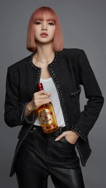 Lisa in black blazer with gold jewelry